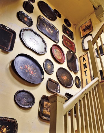 Elizabeth Stetson's collection of Tole Trays (via Country Living  - Decorating With Quirky Antiques)