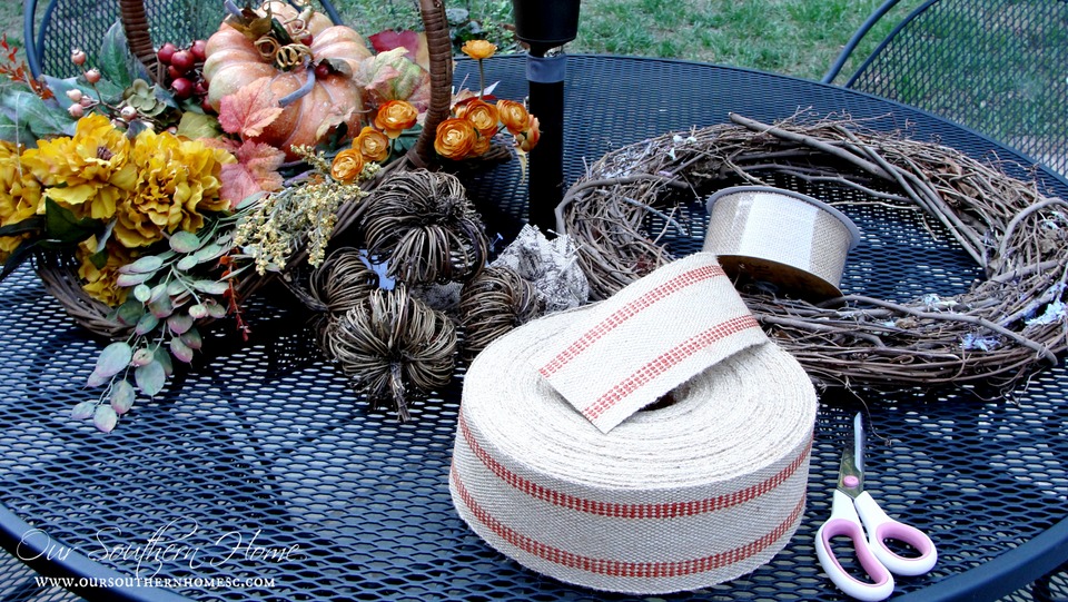 See how I took apart my old fall wreath that was in need of freshening up! I reused it to create a newup to date look for our Fall front entrance. Visit Our Southern Home for the details! #fall #falldecor #fallwreath