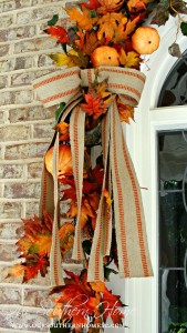 See how I took apart my old fall wreath that was in need of freshening up! I reused it to create a newup to date look for our Fall front entrance. Visit Our Southern Home for the details! #fall #falldecor #fallwreath