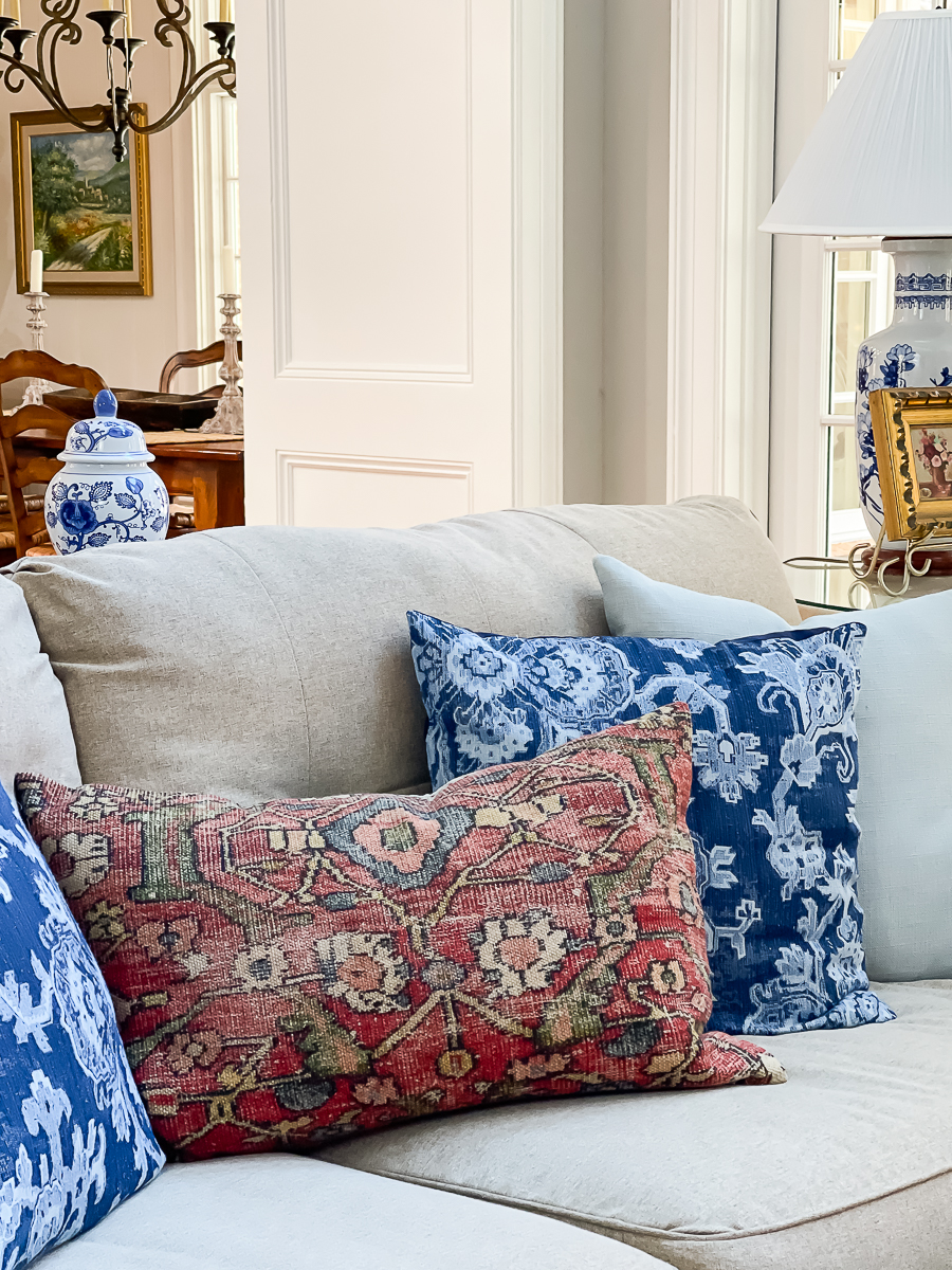 pottery barn pillows for spring on a couch