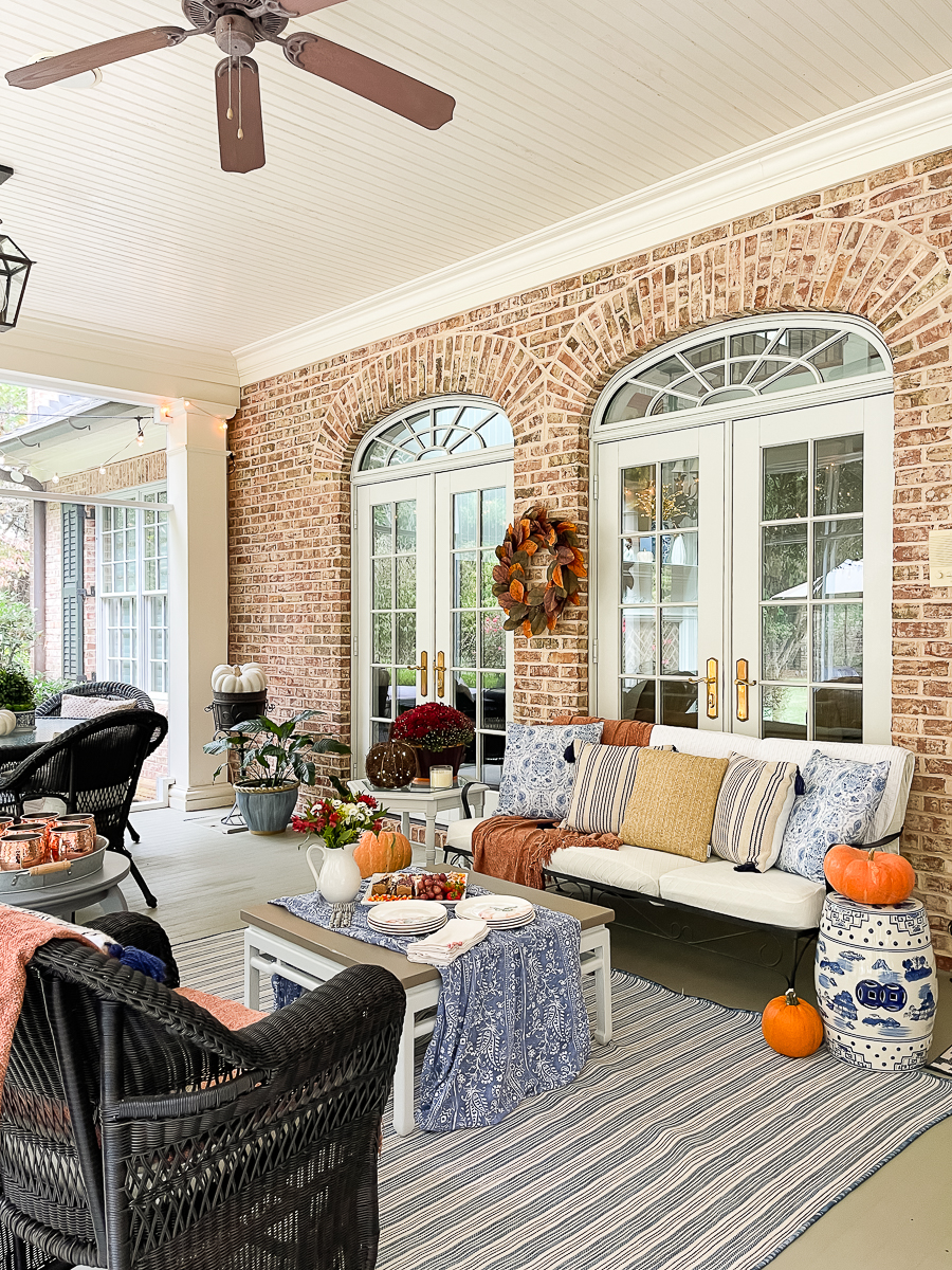 screened porch decorated for fall