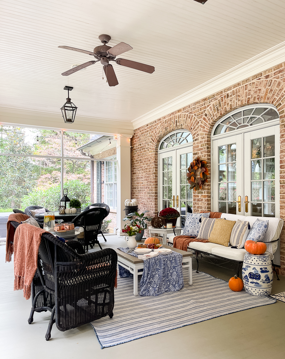 side view of a porch decorated for fall