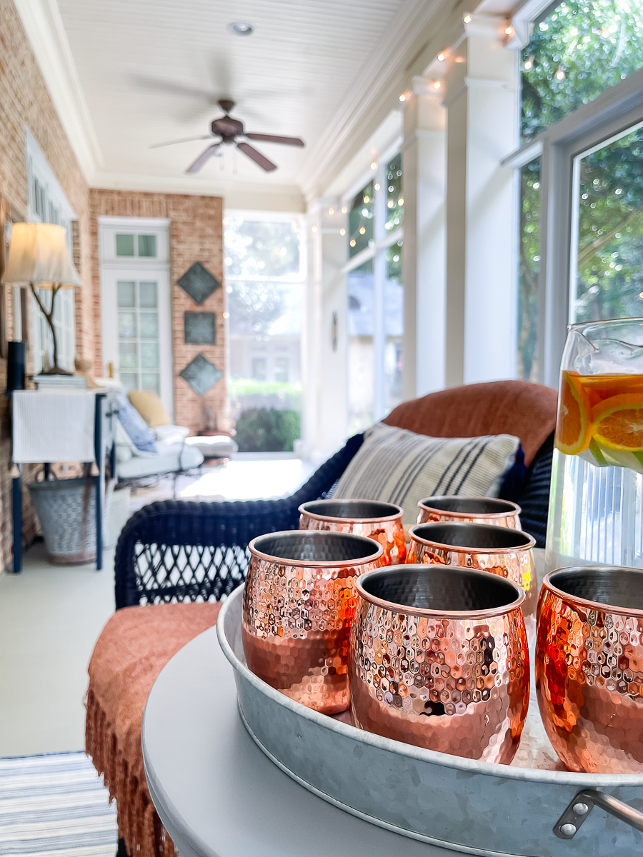 fall porch with copper mugs