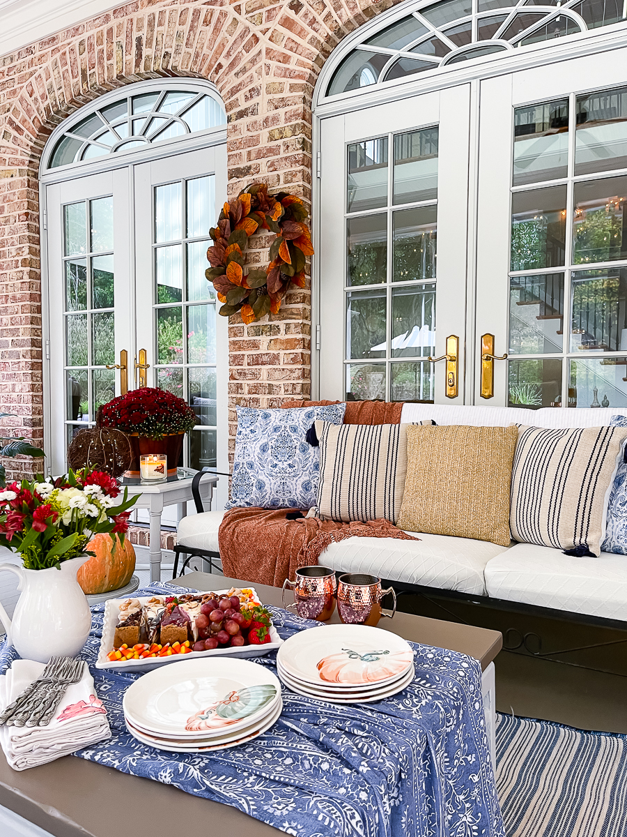 screened porch decorated for fall