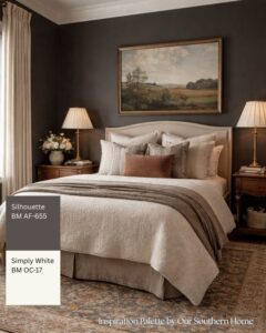 Classic guest room with dark charcoal walls painted in Benjamin Moore Silhouette and neutral layered bedding
