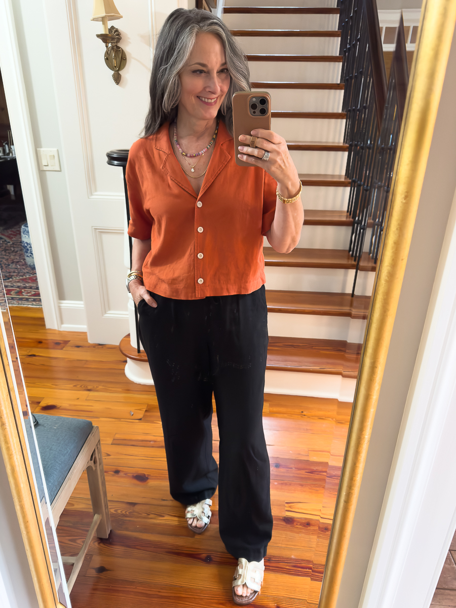 black linen pants and orange linen blouse