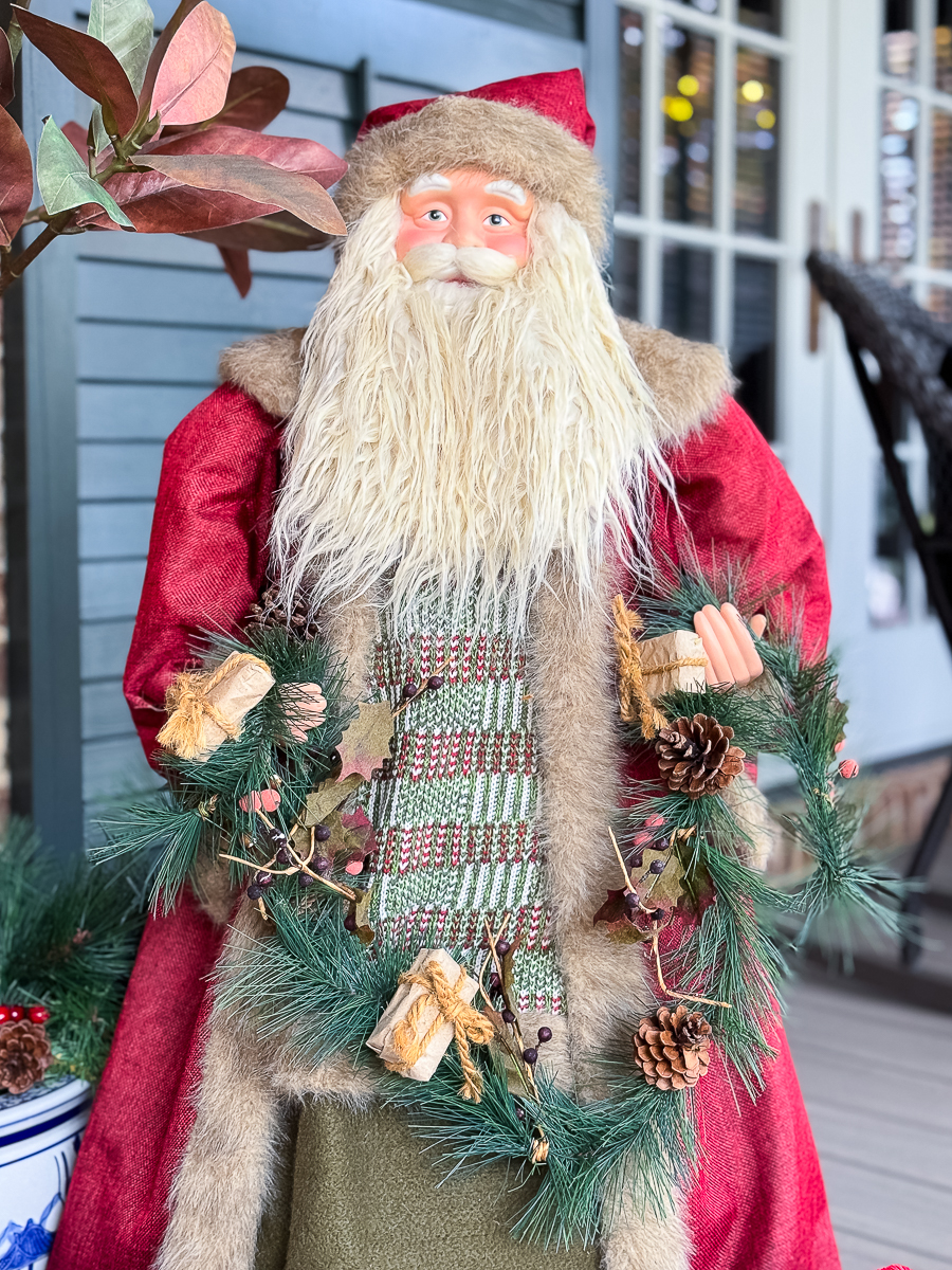 old world santa on porch