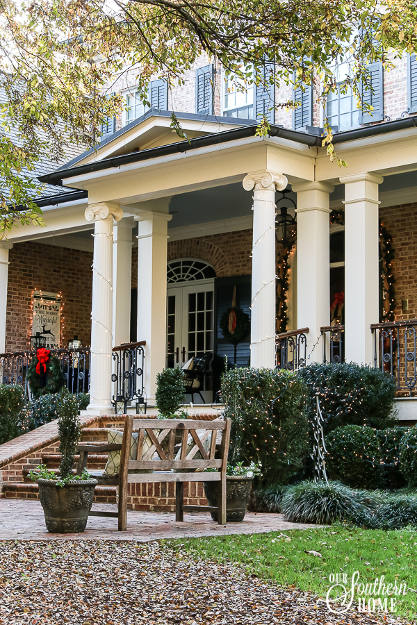 Southern Porch tour full of ideas with plaids and more! #christmas #christmasporch #christmasdecor