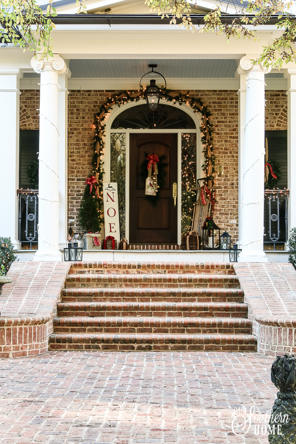 Southern Porch tour full of ideas with plaids and more! #christmas #christmasporch #christmasdecor