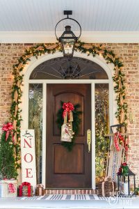 Southern Porch tour full of ideas with plaids and more! #christmas #christmasporch #christmasdecor