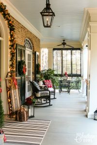 Southern Porch tour full of ideas with plaids and more! #christmas #christmasporch #christmasdecor
