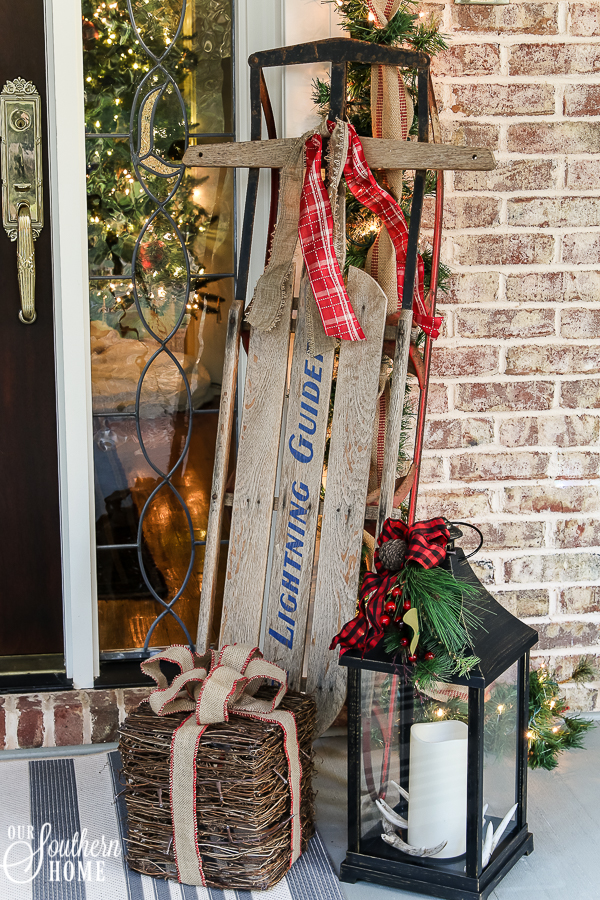 Southern Porch tour full of ideas with plaids and more! #christmas #christmasporch #christmasdecor