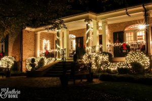 Southern Porch tour full of ideas with plaids and more! #christmas #christmasporch #christmasdecor