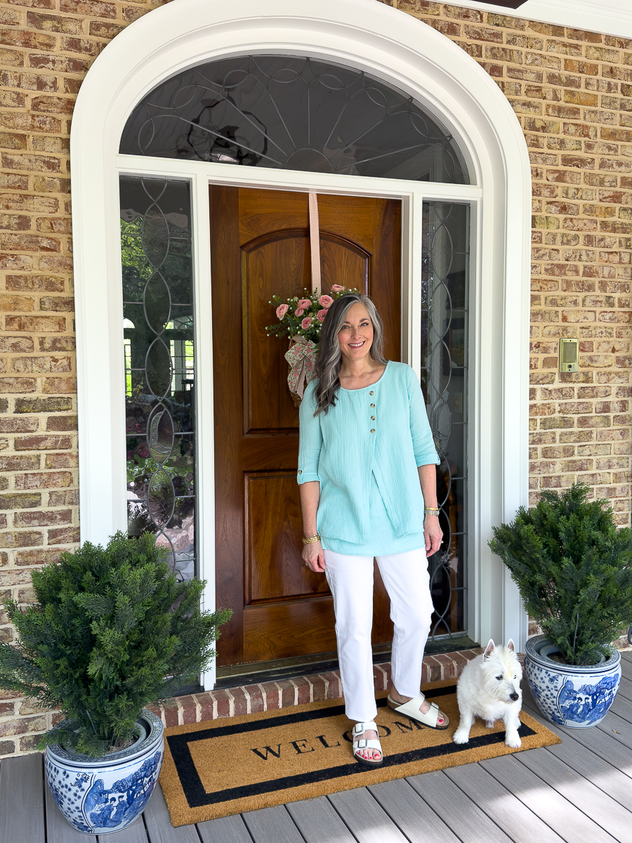 woman with dog on porch