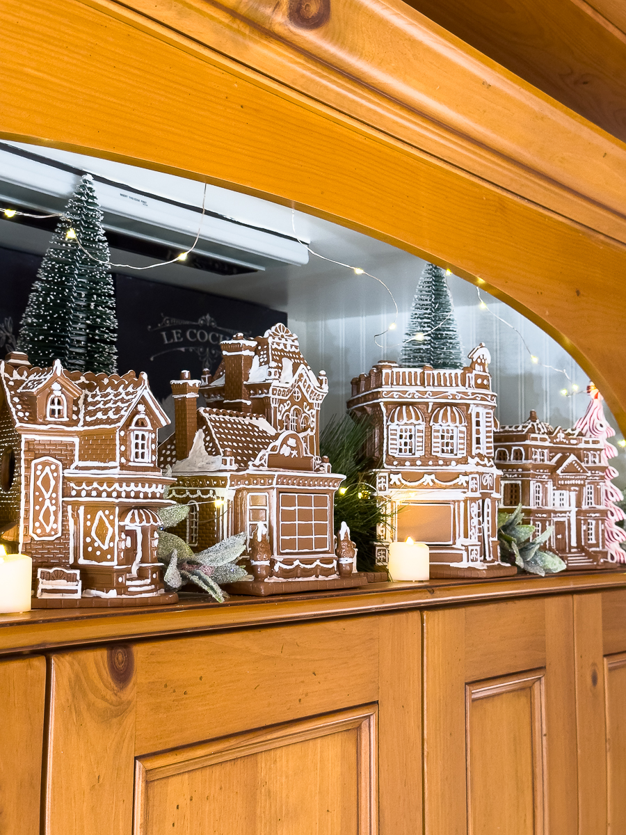 gingerbread village in kitchen cabinet