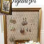 Thrift store framed art is easily turned into an earring organizer!