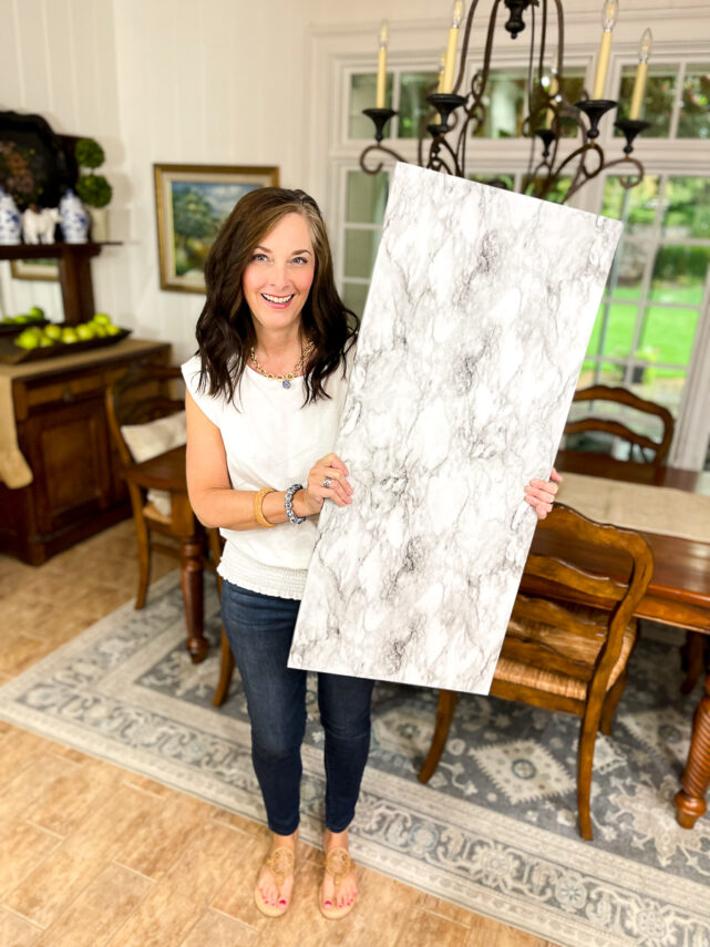 woman holding marble board