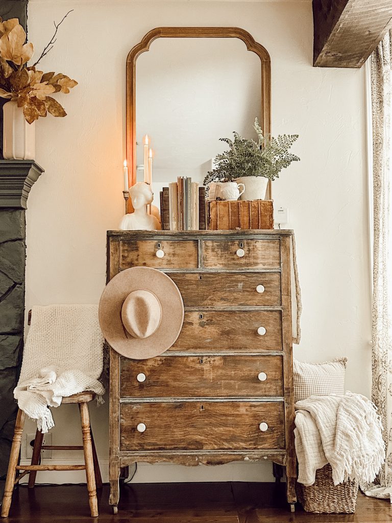 vintage dresser with collected neutral decor