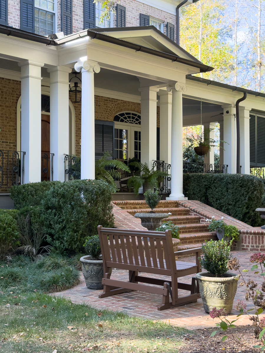 front of brick house with POLYWOOD glider