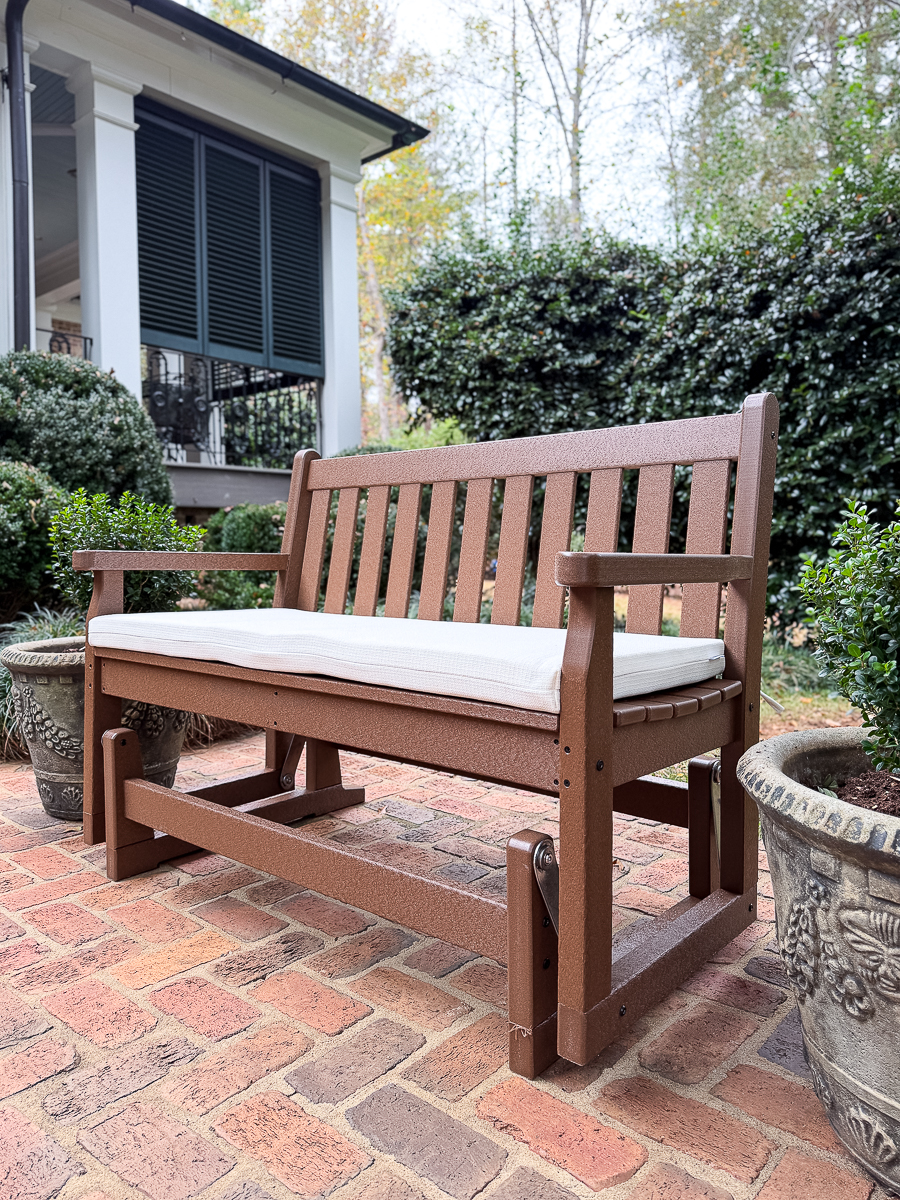 POLYWOOD glider on brick patio
