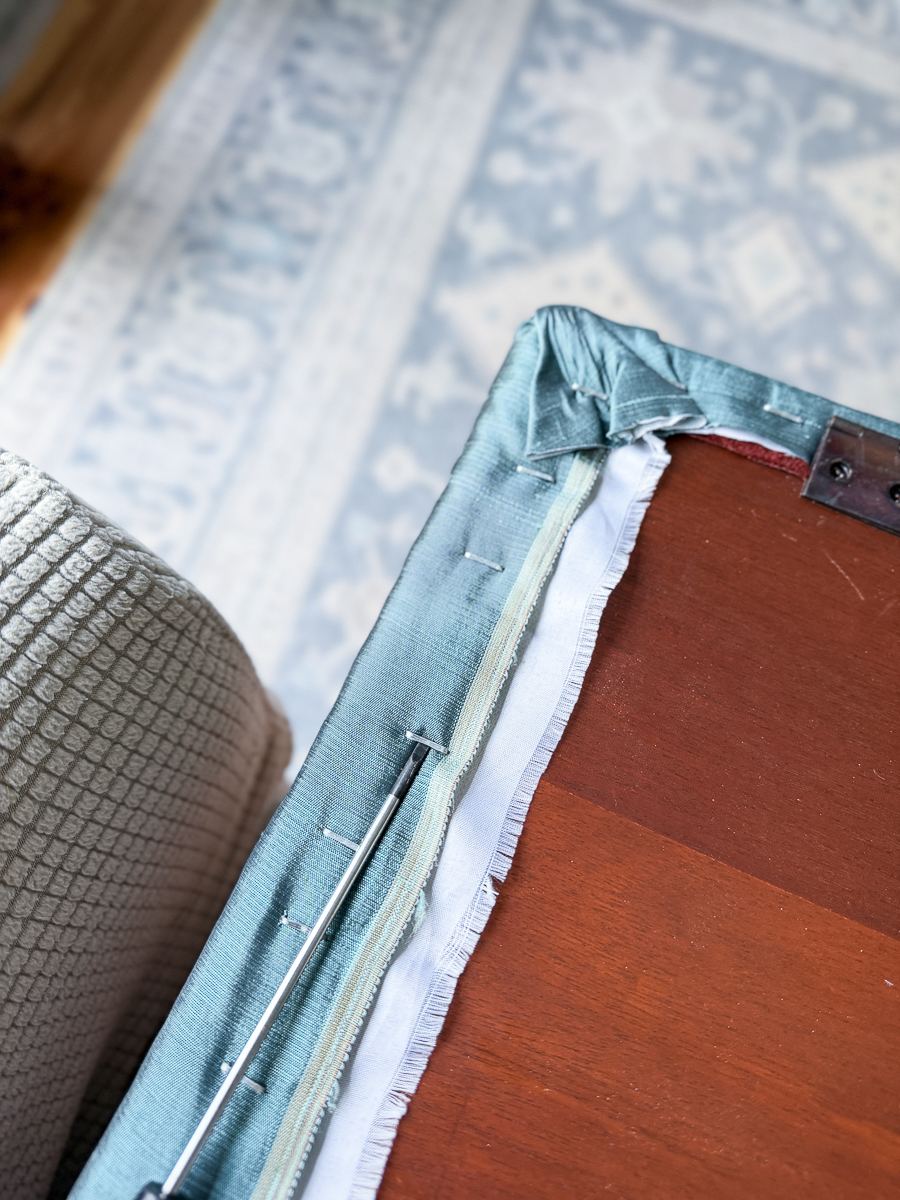 original upholstery on thrifted piano bench before DIY