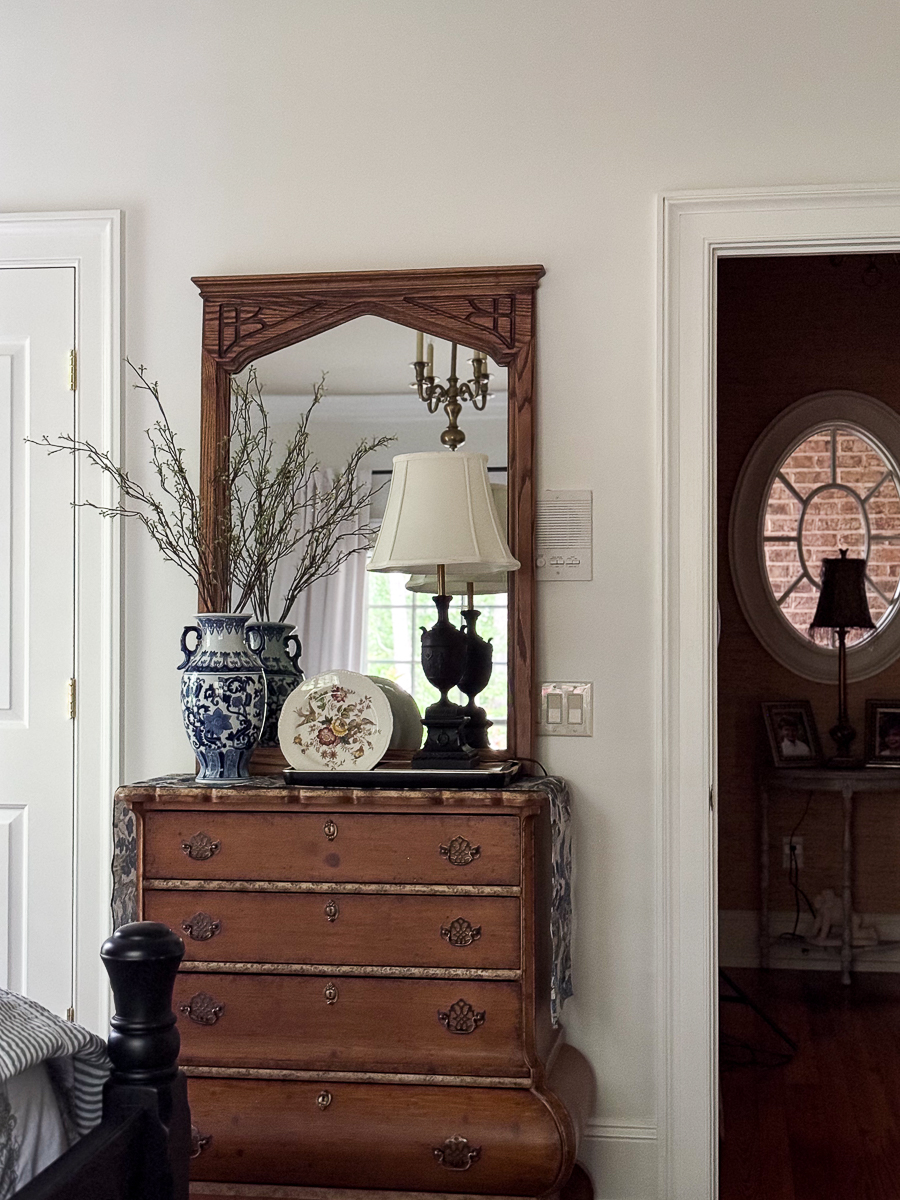Vintage thrifted oak mirror after refinishing styled in bedroom
