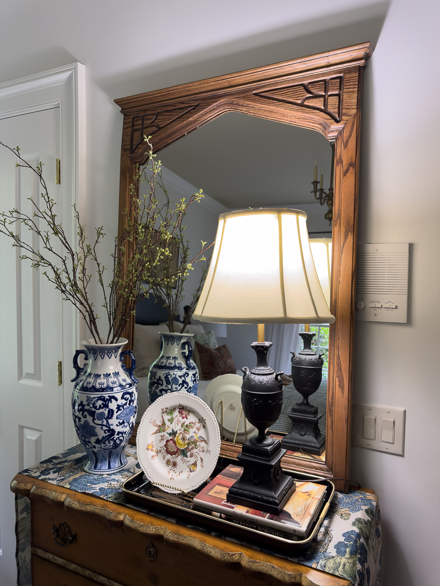 Vintage thrifted oak mirror after refinishing styled in bedroom