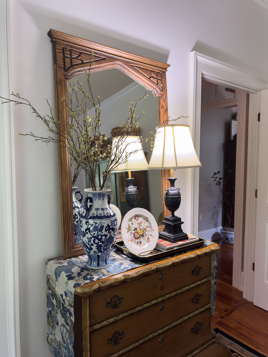Vintage thrifted oak mirror after refinishing styled in bedroom