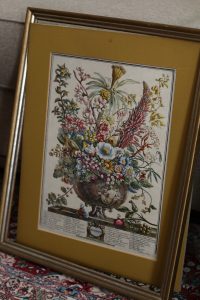 Thrift store framed art is easily turned into an earring organizer!