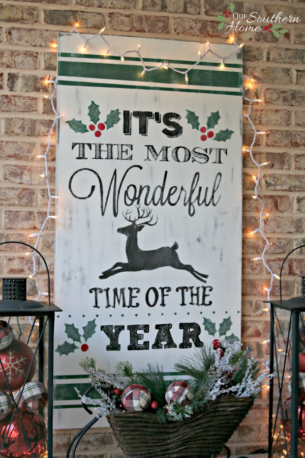 It's the most wonderful time of the year vintage look hand-painted DIY Christmas sign by Our Southern Home. This is much easier that you think! You've got to check it out! #homeforchristmas