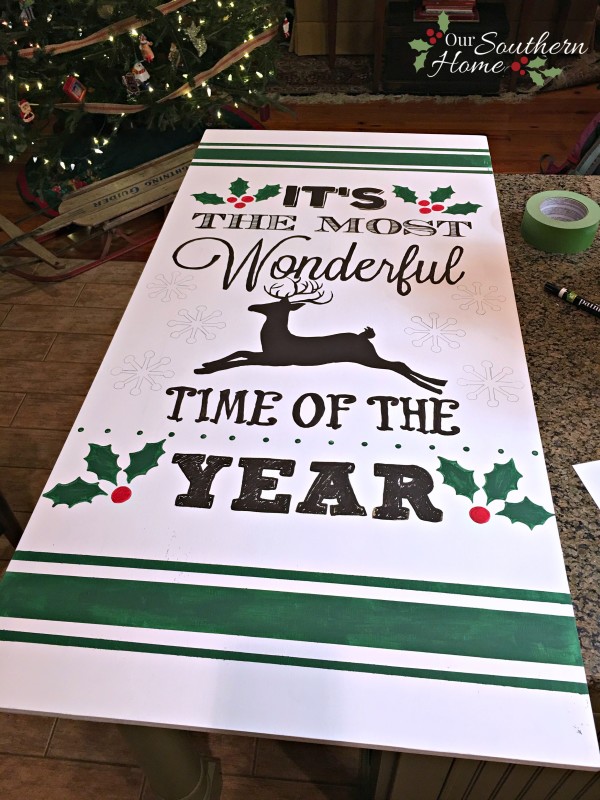 It's the most wonderful time of the year vintage look hand-painted DIY Christmas sign by Our Southern Home. This is much easier that you think! You've got to check it out! #homeforchristmas