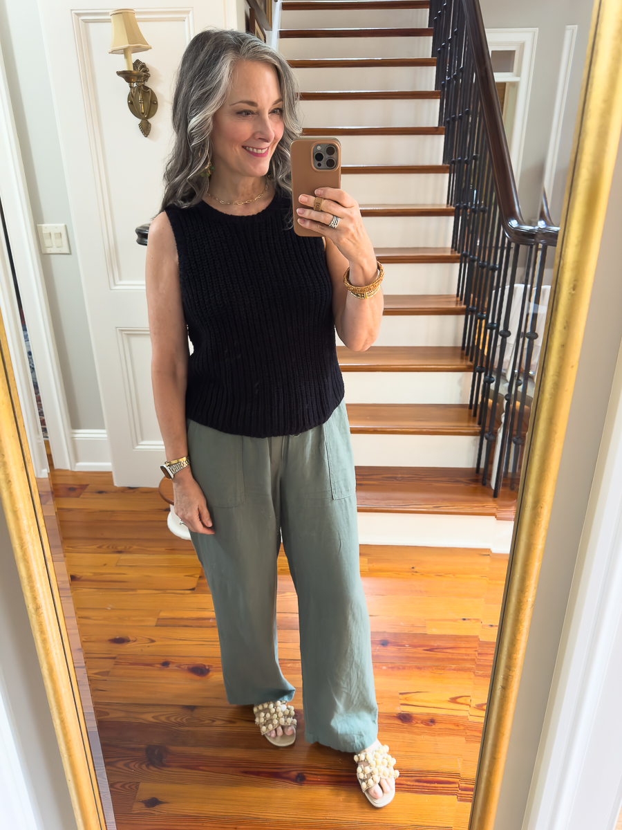 woman in green linen pants and black tank