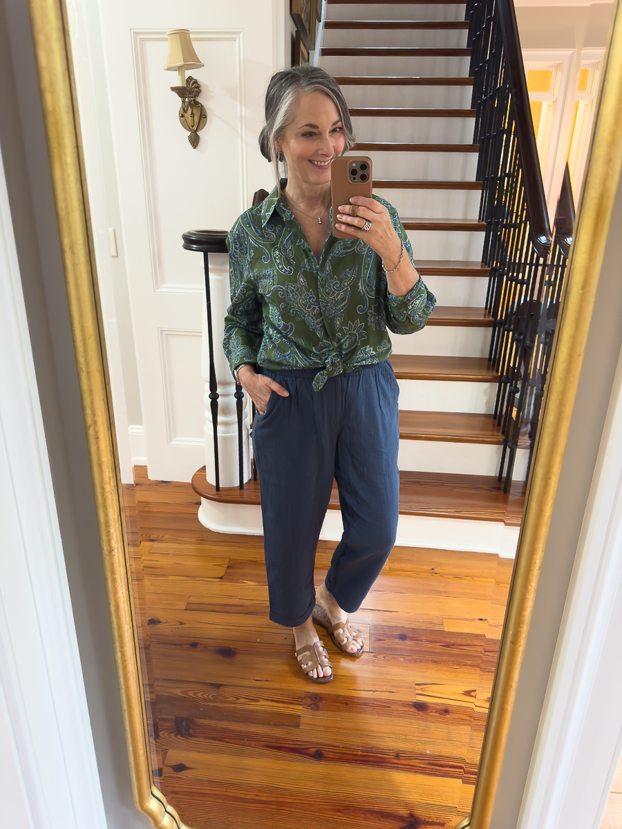 woman in navy pants and paisley button down