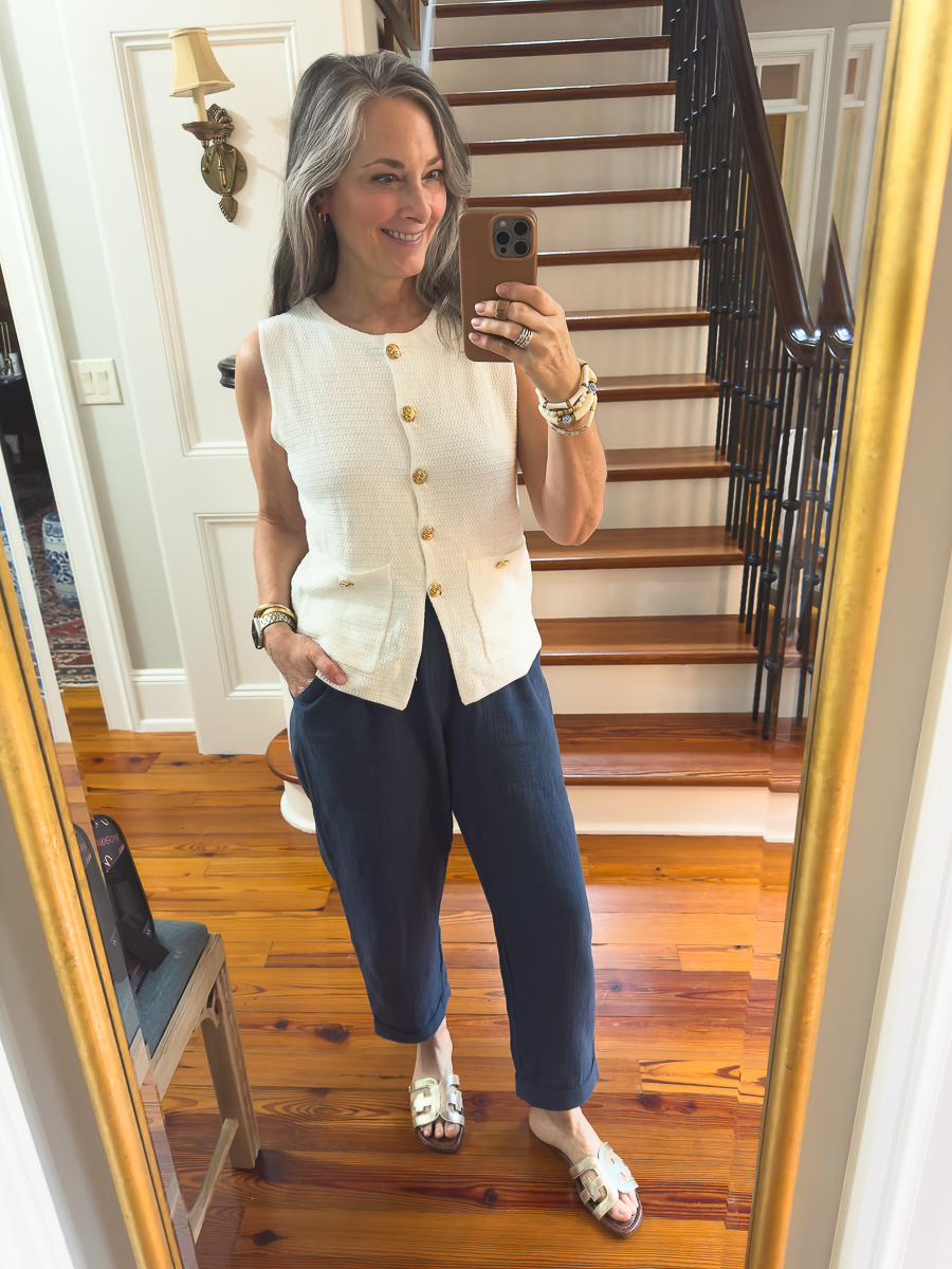 woman in white vest and blue pants