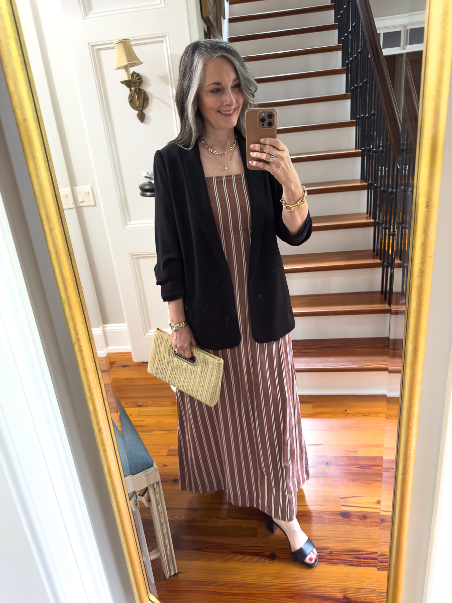 woman in stripe dress and blazer