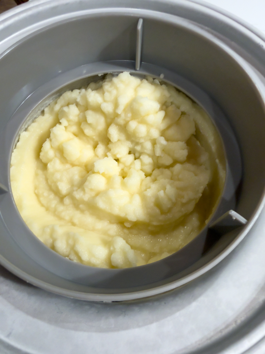 Freshly churned piña colada mixture with a soft frozen texture.