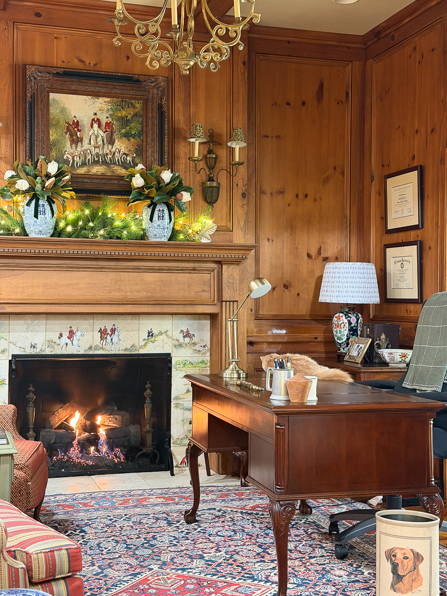 Vintage Facebook Marketplace lamp with block‑print shade styled on a wood desk in a pine‑paneled study