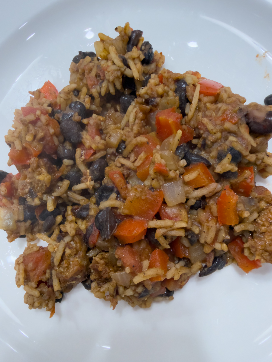 Rice bowl with chorizo sausage black beans tomatoes and peppers