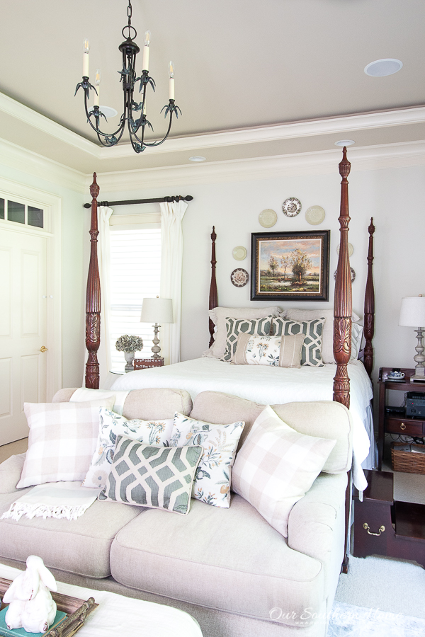 master bedrrom with rices bed and traditional touches with blues and greens