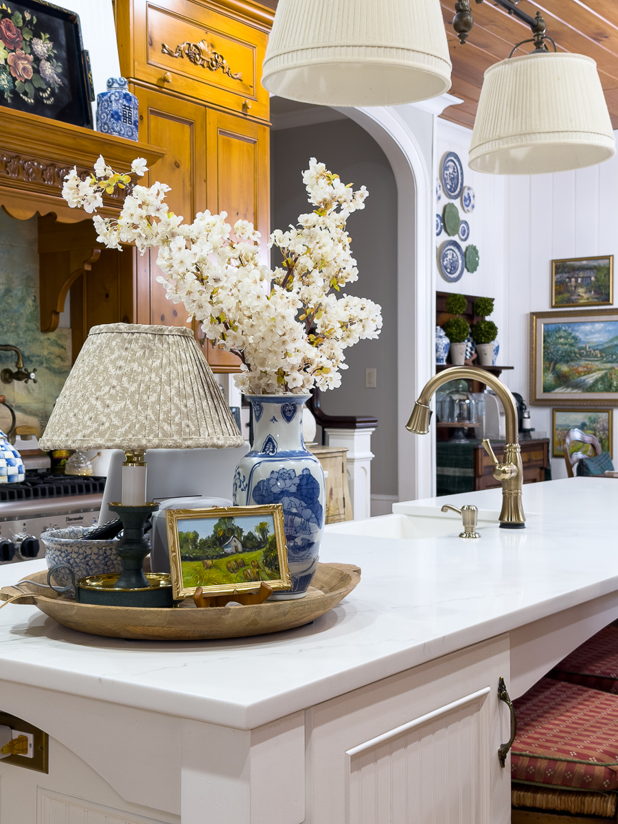 white quartz kitchen counters with grand millennial decor