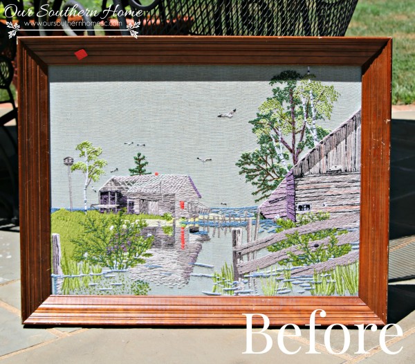 Thrift store needlework art become a showpiece on the screened porch with a new finish to the frame.