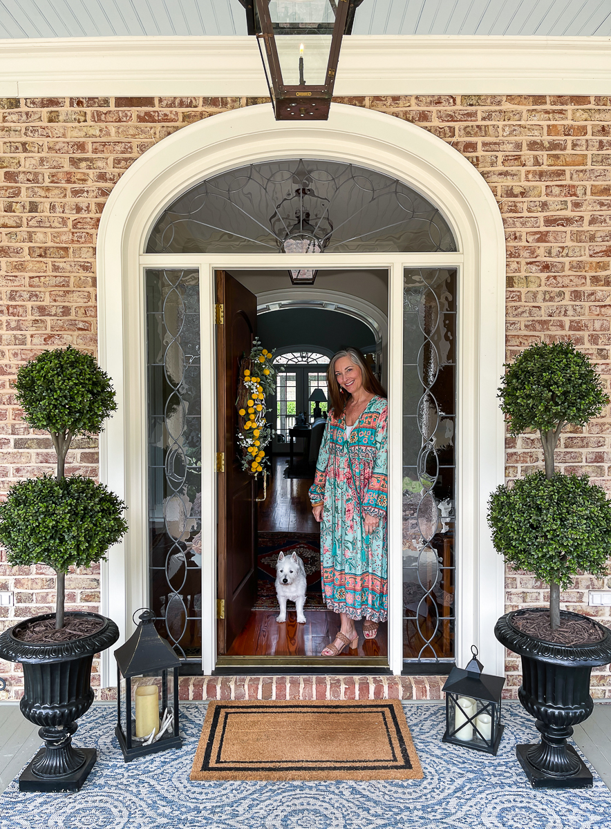 floral spring dress on woman in doorway