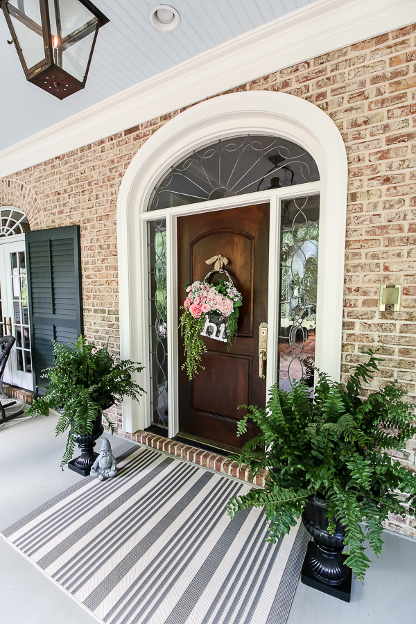 Cottage farmhouse style basket wreath is this month's thrift store makeover! Many ideas brought to you each month from the team! #thriftstore #makeover #wreath #basketwreath #frontdoor