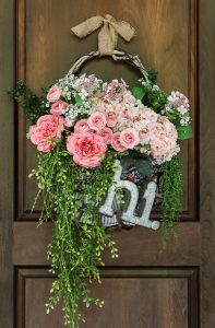 Cottage farmhouse style basket wreath is this month's thrift store makeover! Many ideas brought to you each month from the team! #thriftstore #makeover #wreath #basketwreath #frontdoor