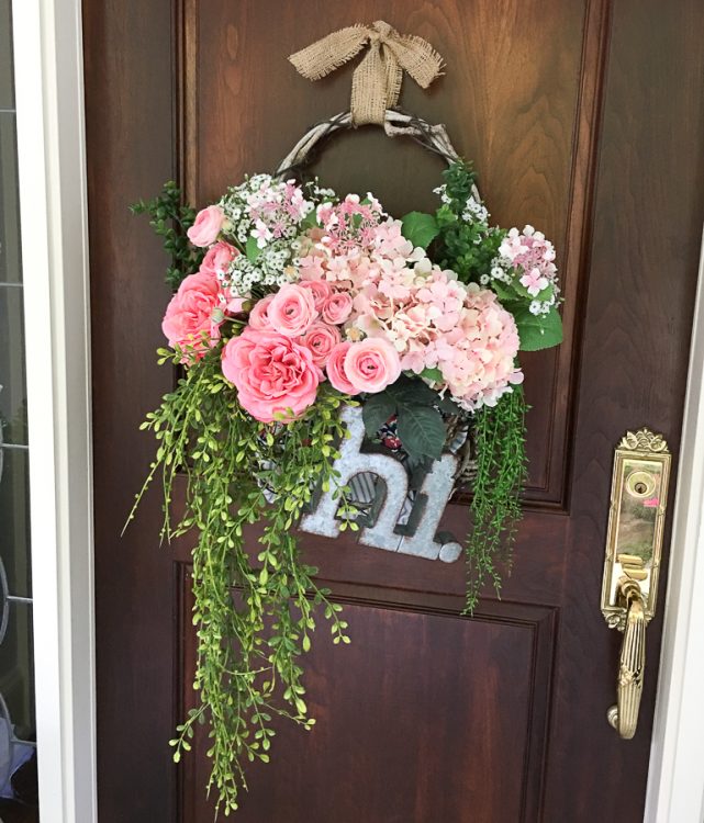 Cottage farmhouse style basket wreath is this month's thrift store makeover! Many ideas brought to you each month from the team! #thriftstore #makeover #wreath #basketwreath #frontdoor