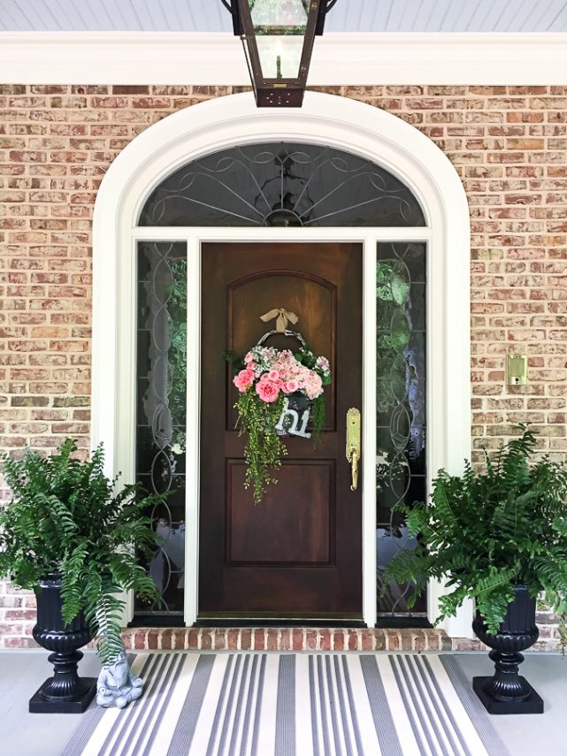 Cottage farmhouse style basket wreath is this month's thrift store makeover! Many ideas brought to you each month from the team! #thriftstore #makeover #wreath #basketwreath #frontdoor