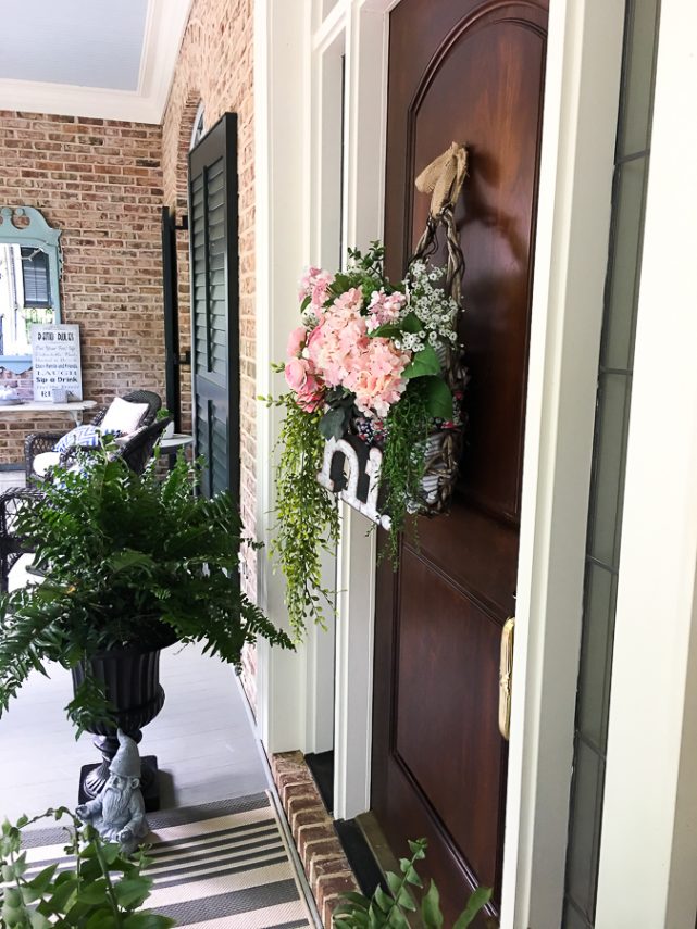 Cottage farmhouse style basket wreath is this month's thrift store makeover! Many ideas brought to you each month from the team! #thriftstore #makeover #wreath #basketwreath #frontdoor