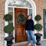 woman standing on porch