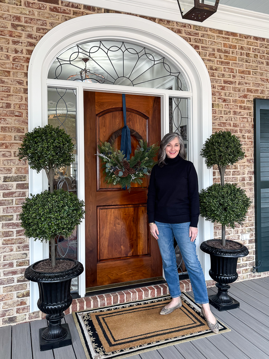 woman standing on porch