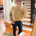 mirror selfie in jeans, sneakers and tan sweater